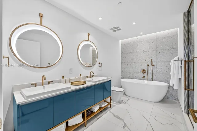 a bedroom with a bed and a mirror