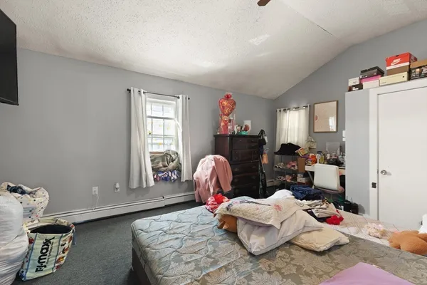 a living room with furniture chess table and a window
