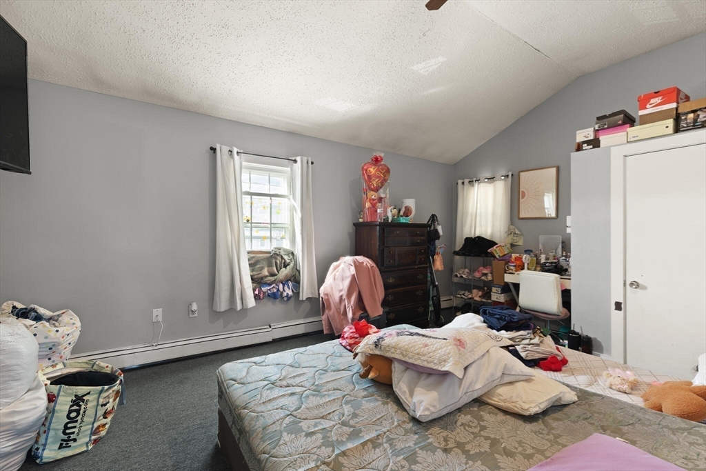 74 Chestnut Street Chelsea, MA 02150 - Photo 23 of 37 a living room with furniture chess table and a window