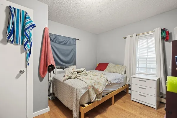 a bedroom with a bed and a closet