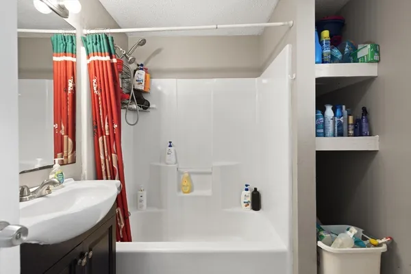 a bathroom with a sink and a bathtub