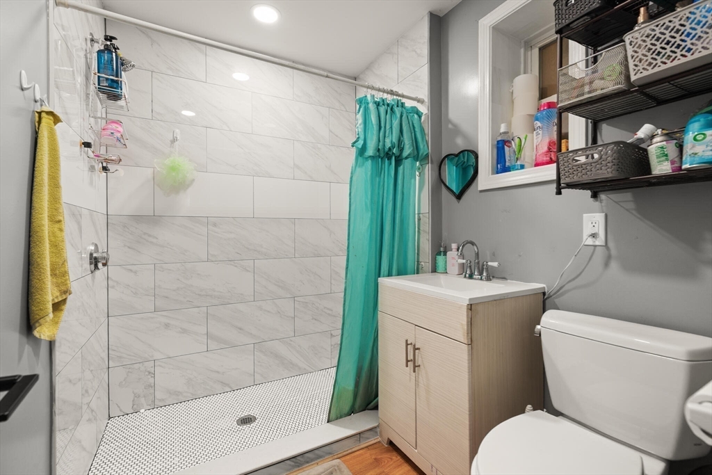 74 Chestnut Street Chelsea, MA 02150 - Photo 28 of 37 a bathroom with a sink toilet and shower