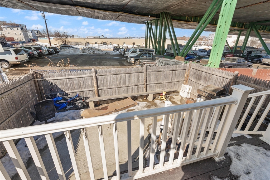 74 Chestnut Street Chelsea, MA 02150 - Photo 31 of 37 a view of a chairs and table in the balcony