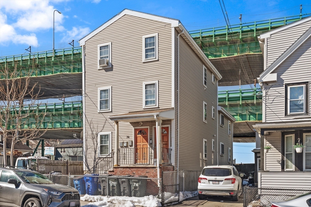 74 Chestnut Street Chelsea, MA 02150 - Photo 33 of 37 a car parked in front of a house