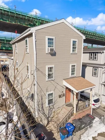 a aerial view of a house with a yard