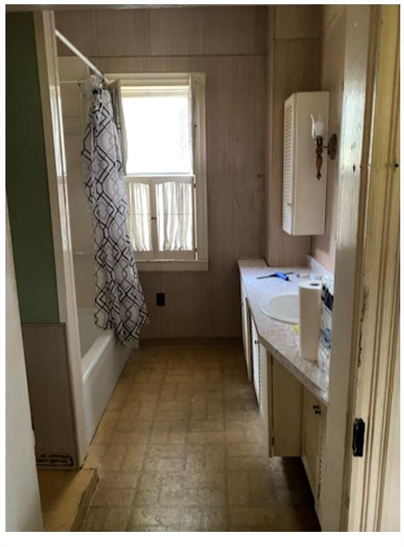 695 Main Street Addison, PA 15411 - Photo 8 of 11 a bathroom with a sink a mirror and a shower