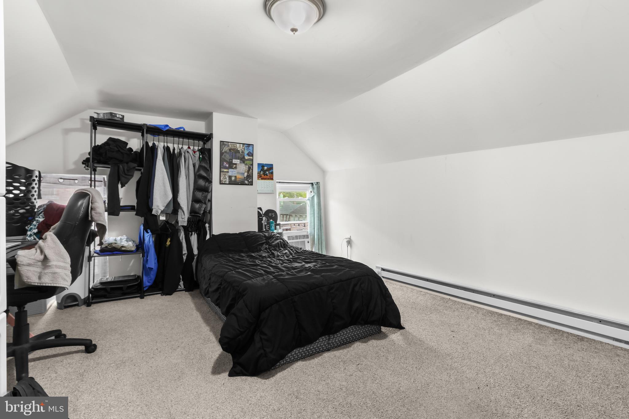 12 South Front Street Coplay, PA 18037 - Photo 17 of 42 a bedroom with a bed and gym equipment