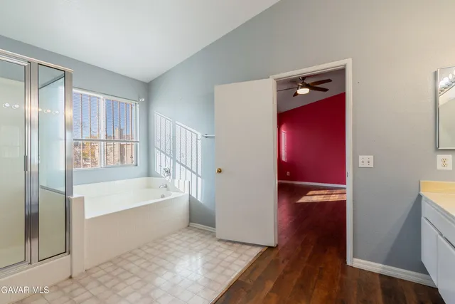 a bathroom with a bathtub and a shower