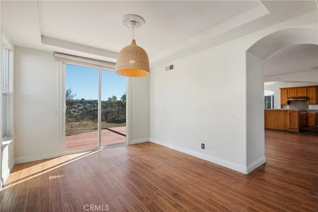 a bathroom with a granite countertop sink double vanity and a mirror