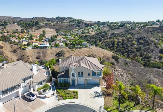 an aerial view of a house with a lake view