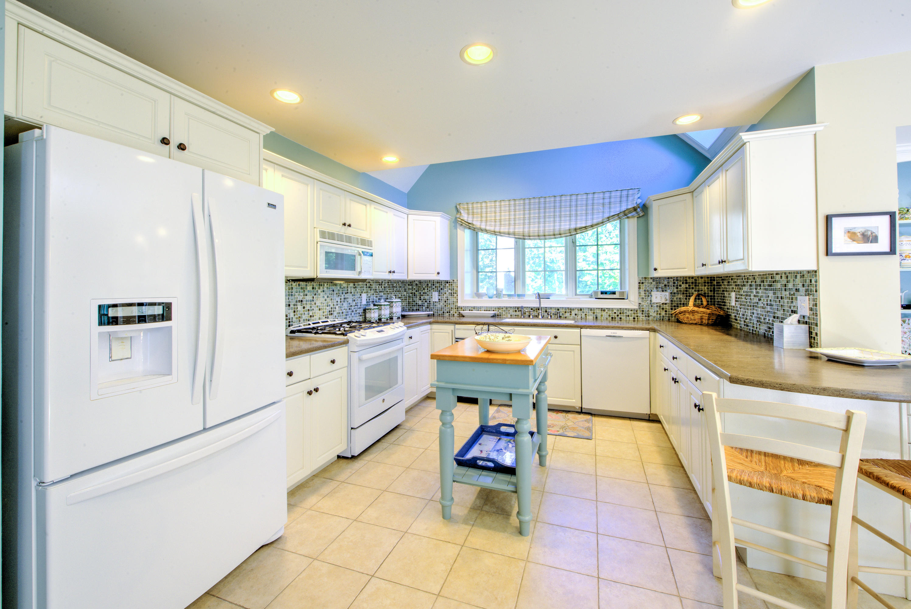 48 Crystal Ridge Road Marstons Mills, MA 02648 - Photo 12 of 26 a kitchen with stainless steel appliances a refrigerator sink and cabinets