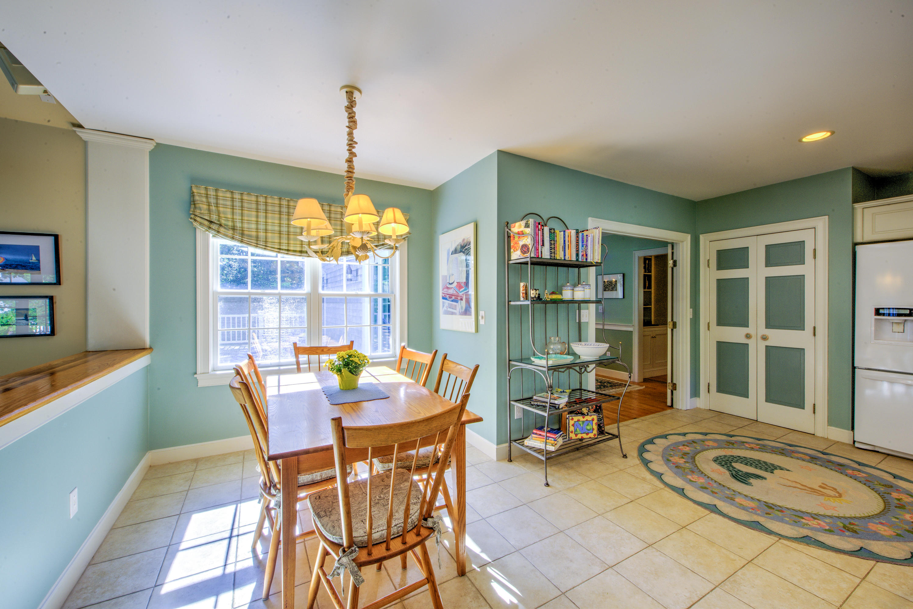 48 Crystal Ridge Road Marstons Mills, MA 02648 - Photo 14 of 26 a dining room with furniture a chandelier and window