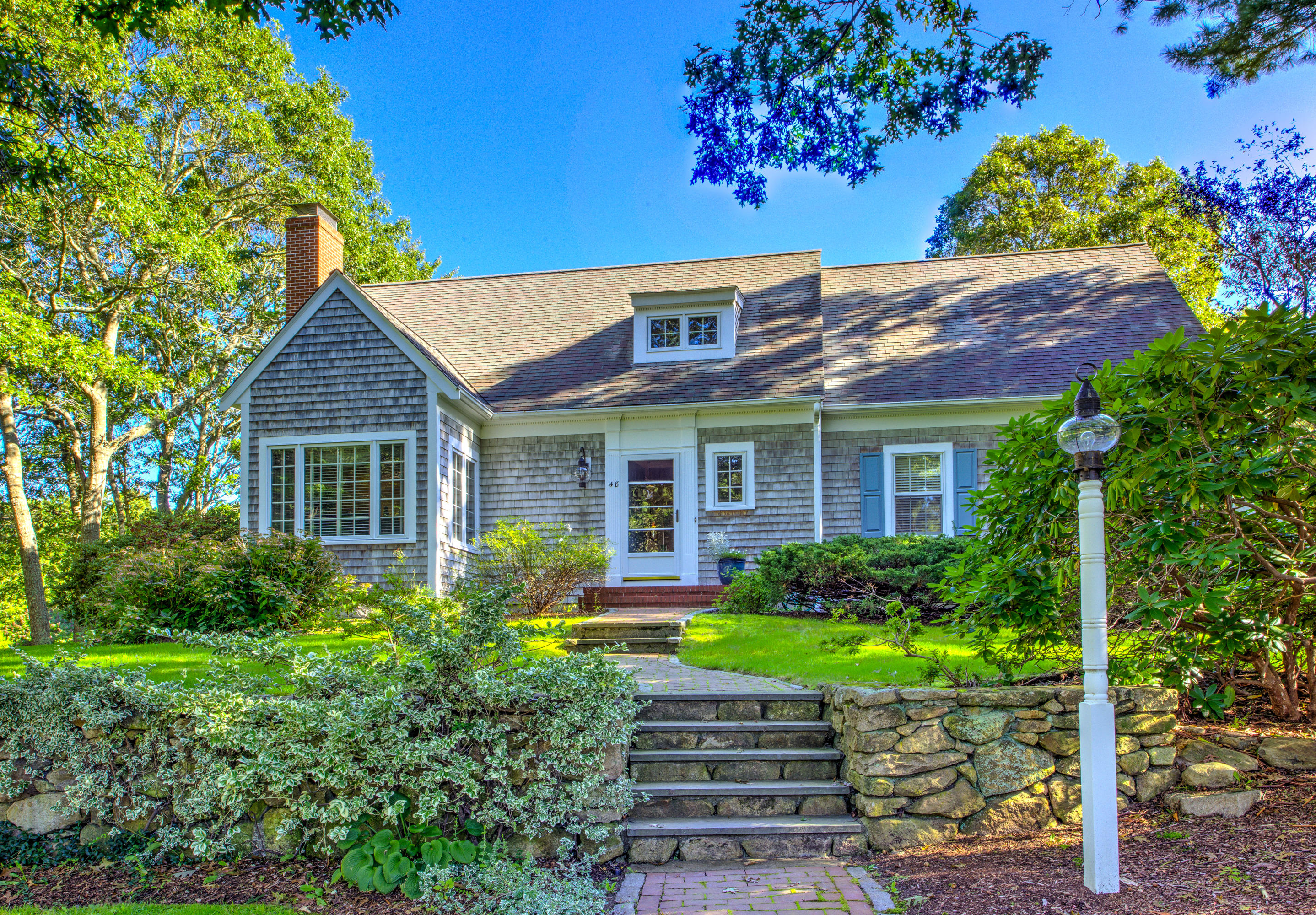 48 Crystal Ridge Road Marstons Mills, MA 02648 - Photo 2 of 26 a front view of a house with a yard