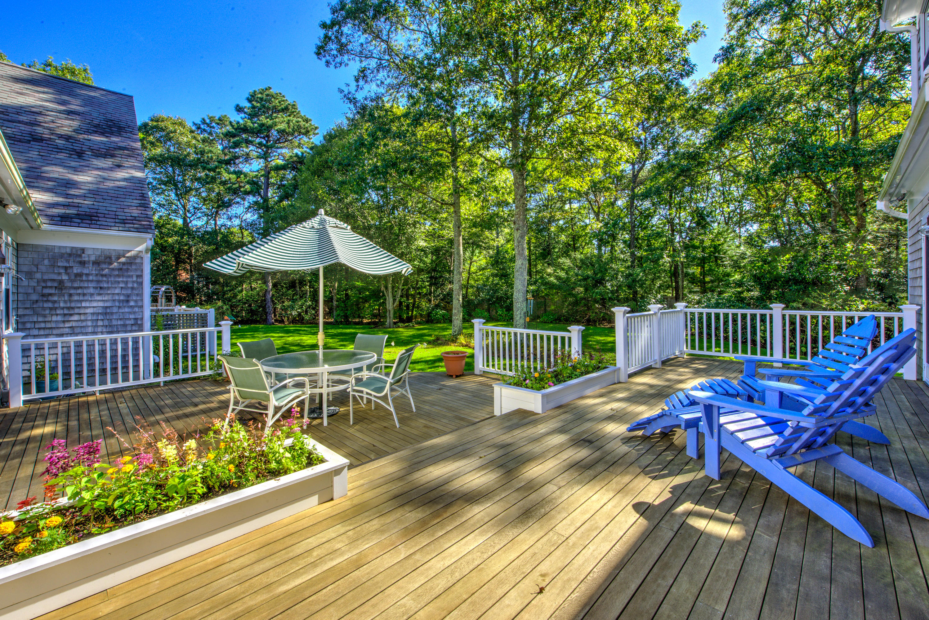 48 Crystal Ridge Road Marstons Mills, MA 02648 - Photo 22 of 26 a view of a chair and tables on the roof deck