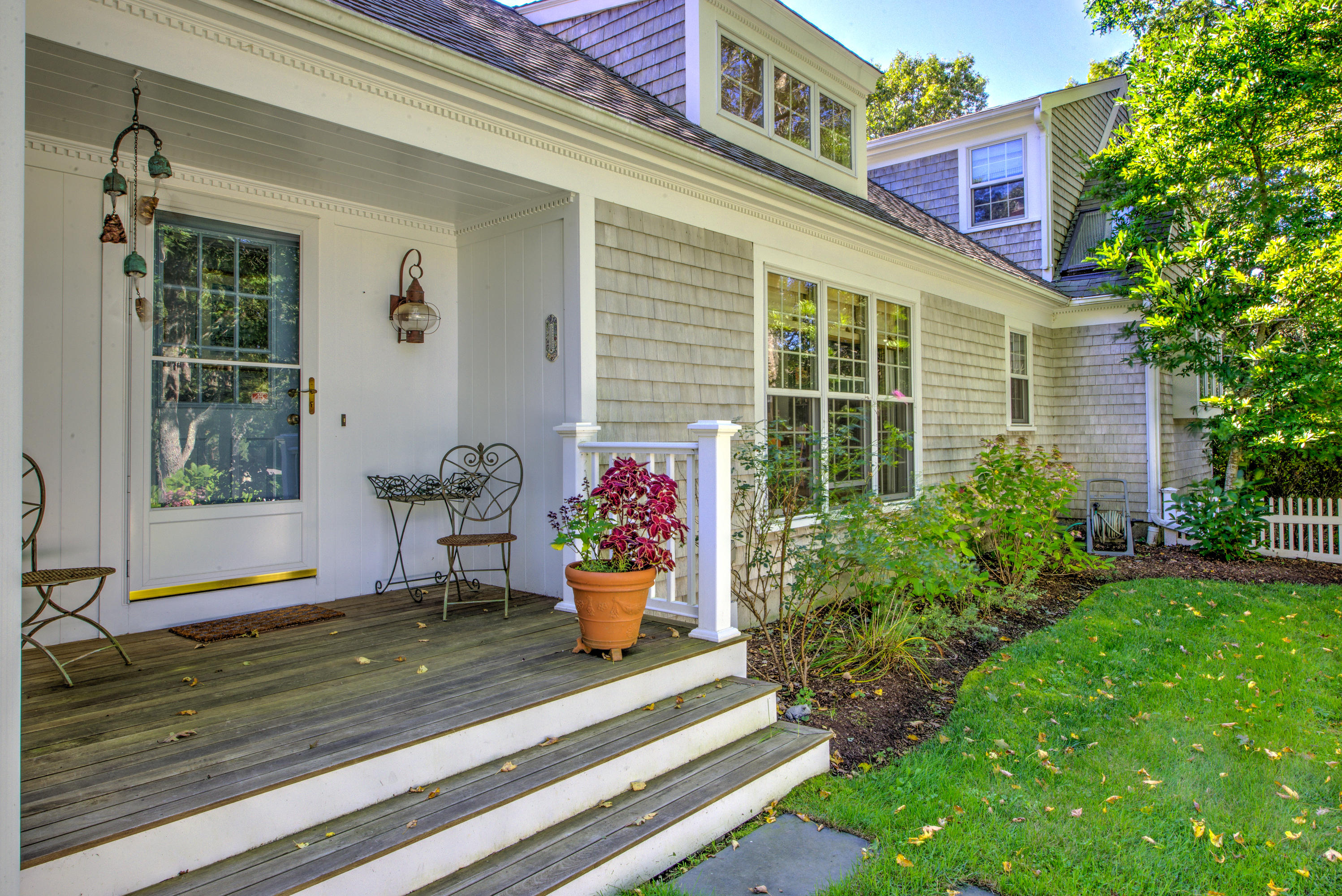 48 Crystal Ridge Road Marstons Mills, MA 02648 - Photo 24 of 26 a view of a house with sitting area and garden