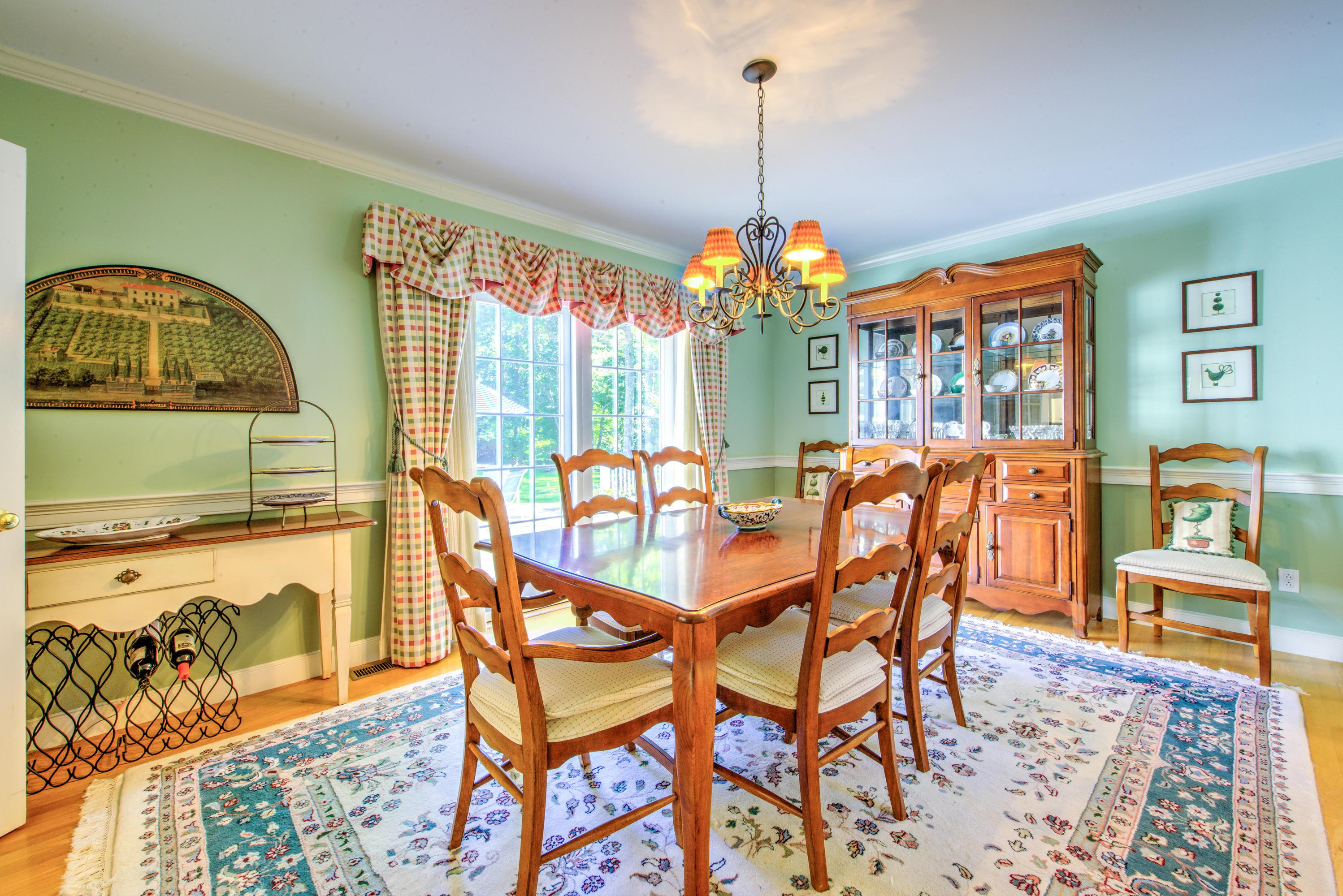 48 Crystal Ridge Road Marstons Mills, MA 02648 - Photo 6 of 26 a dining room with furniture a chandelier and wooden floor