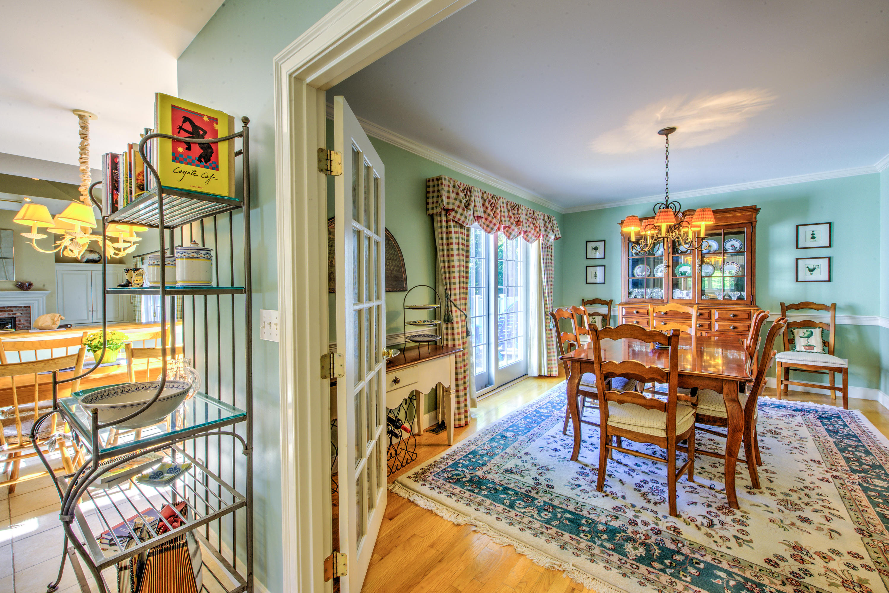 48 Crystal Ridge Road Marstons Mills, MA 02648 - Photo 7 of 26 a dining room with furniture a rug and a chandelier