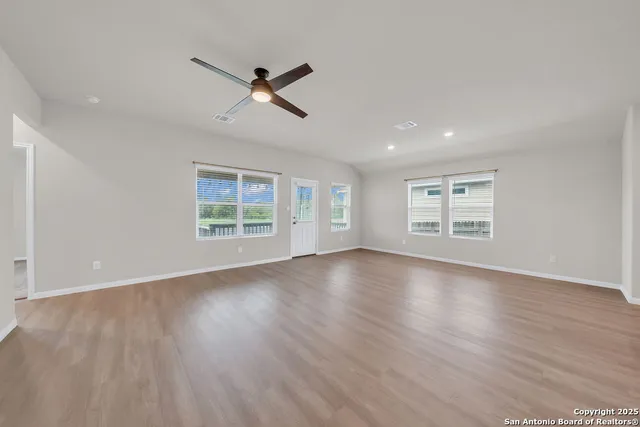 a view of kitchen with furniture and wooden floor