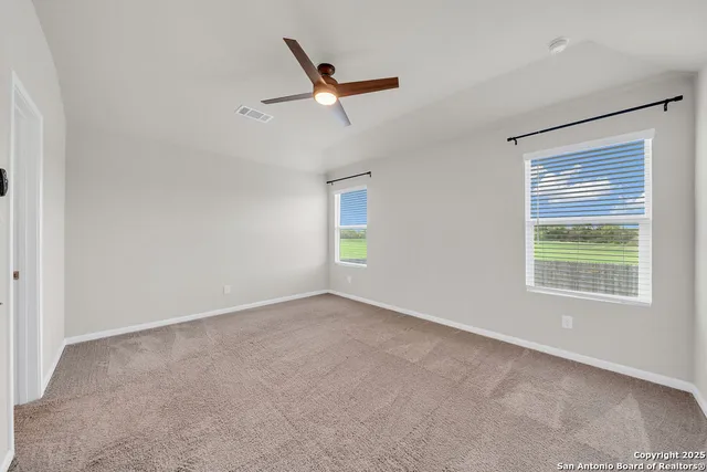 a bathroom with a granite countertop sink mirror and vanity