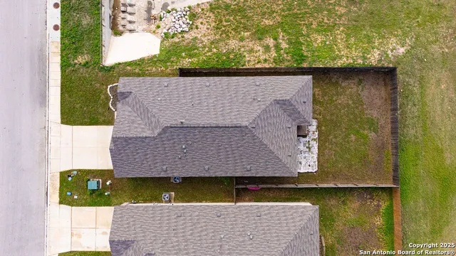 a view of building with outdoor space and mountain view in back
