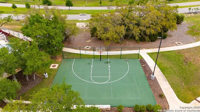 a view of a swimming pool with a yard