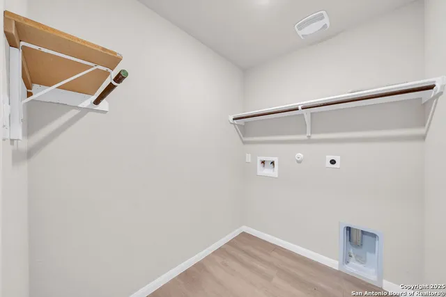 a large kitchen with stainless steel appliances granite countertop a large counter top a stove and a sink