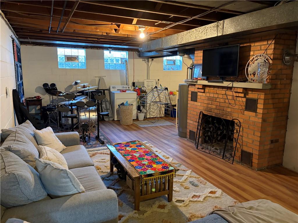 359 Dorseyville Road Pittsburgh, PA 15215 - Photo 21 of 29 a living room with furniture a flat screen tv and a fireplace