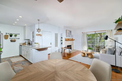 a large white kitchen with a large window