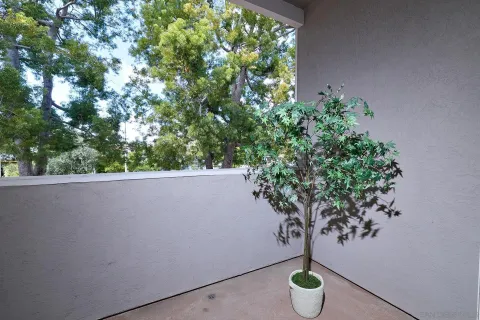 a view of a table and a chair in a balcony