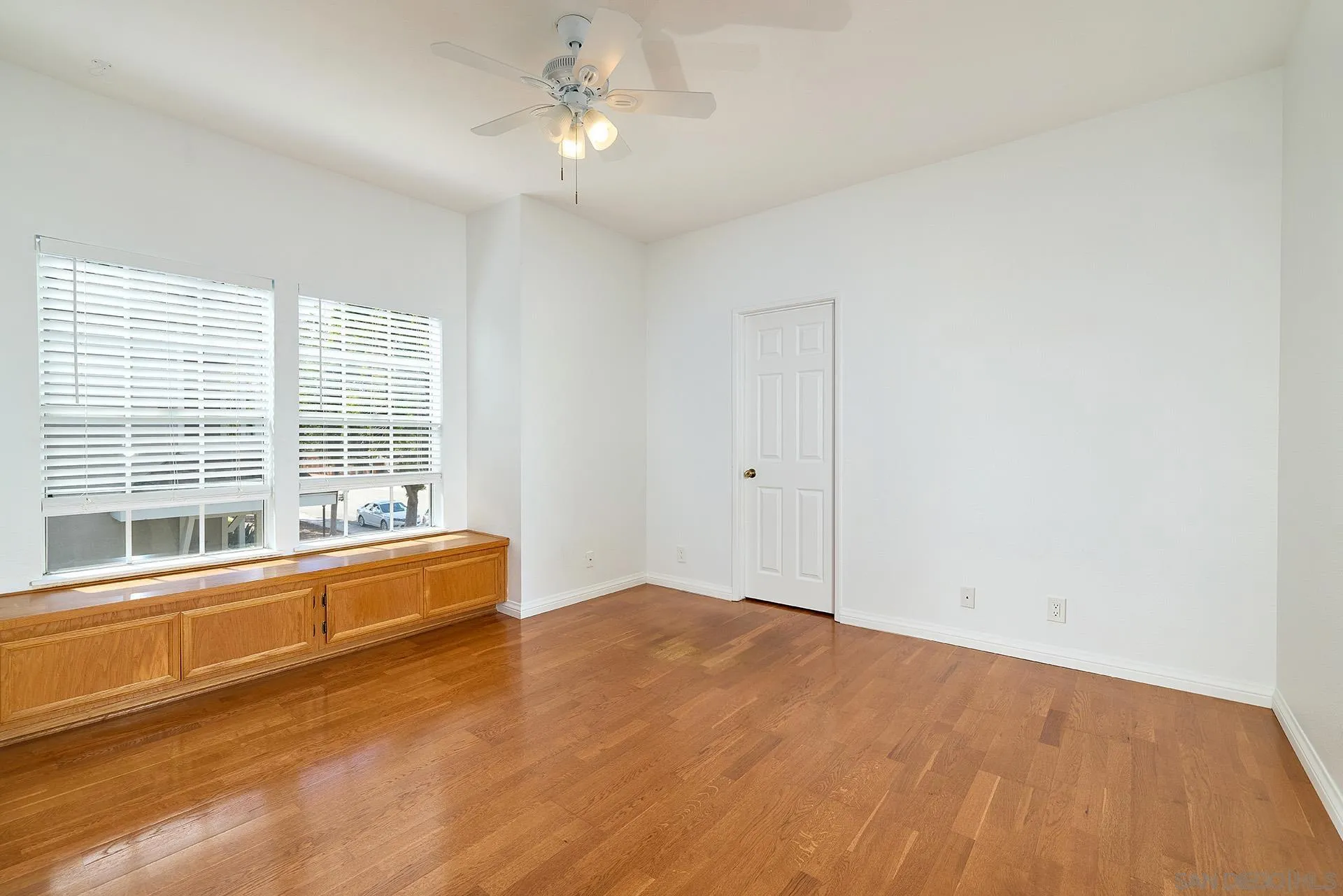 13826 Midland Road Poway, CA 92064 - Photo 17 of 38 a view of empty room with wooden floor and fan