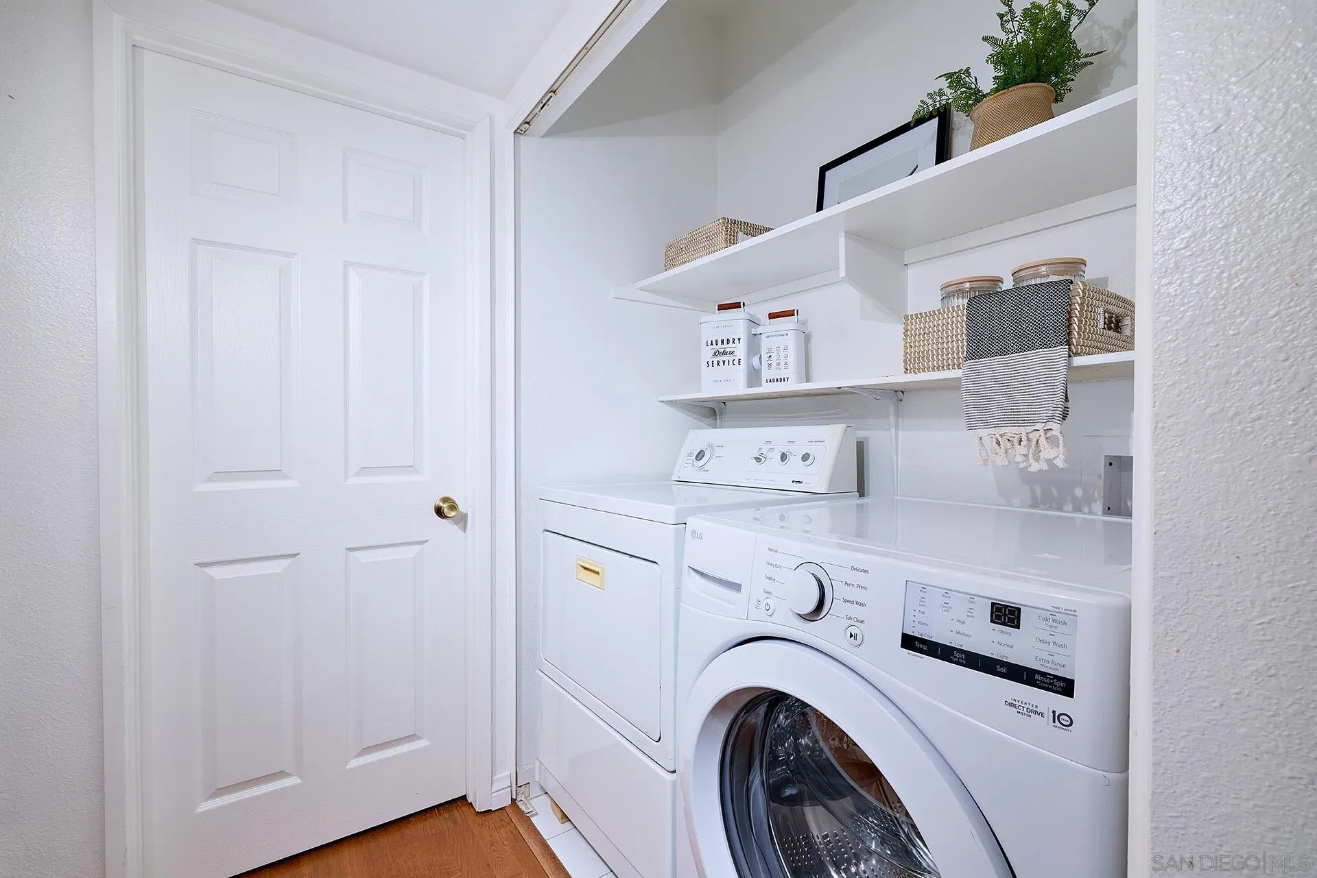 13826 Midland Road Poway, CA 92064 - Photo 19 of 38 a view of washer and dryer in a utility room