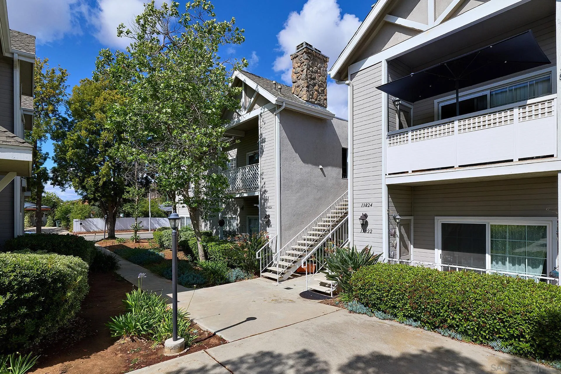 13826 Midland Road Poway, CA 92064 - Photo 21 of 38 a front view of a house with a yard