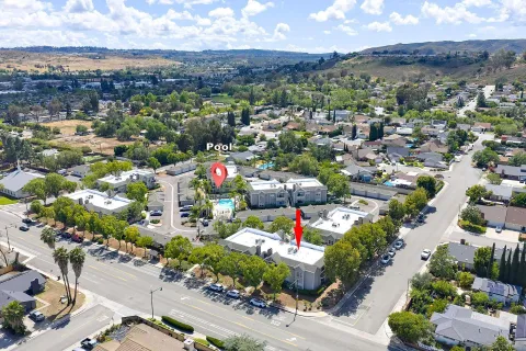 an aerial view of a houses and city street