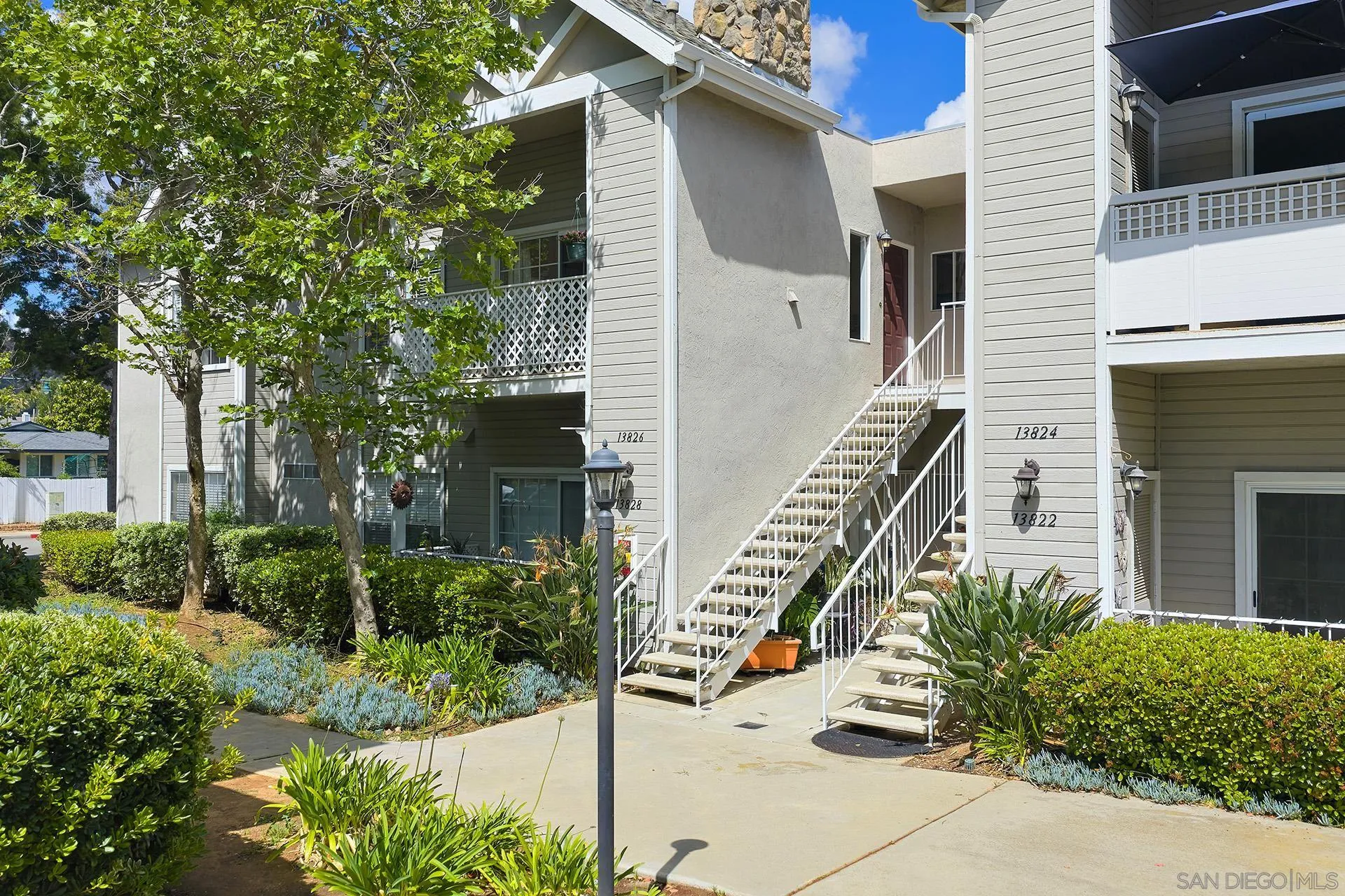 13826 Midland Road Poway, CA 92064 - Photo 4 of 38 a front view of a house with a garden