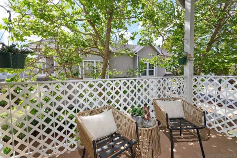 front view of a house with a bench