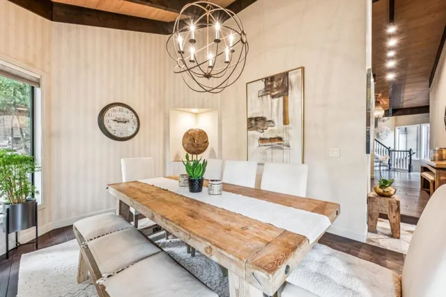 a living room with table and chairs