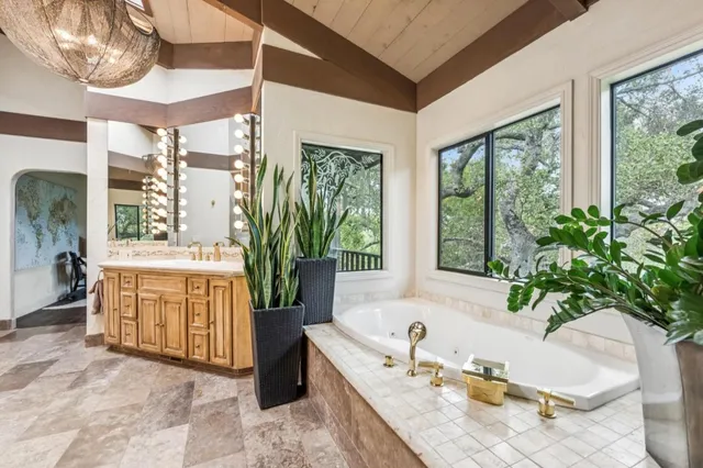 a spacious bathroom with a tub and sink