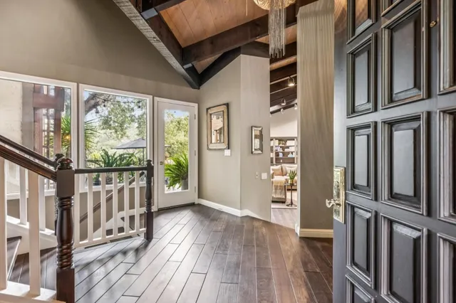 a view of a balcony with wooden floor