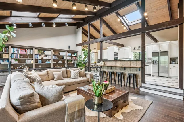 a living room with furniture and a table