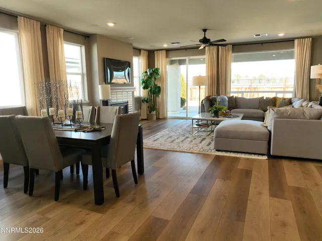a view of a dining room with furniture and window