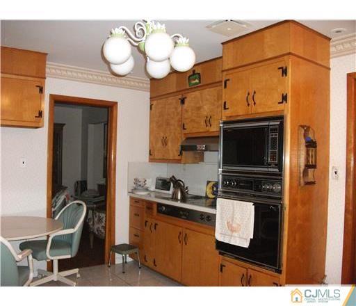 21 Highland Road Colonia, NJ 07067 - Photo 2 of 10 a kitchen with a sink cabinets and appliances