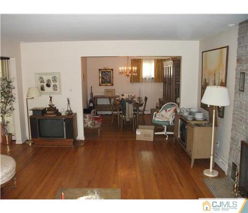 21 Highland Road Colonia, NJ 07067 - Photo 7 of 10 a living room with furniture and a wooden floor