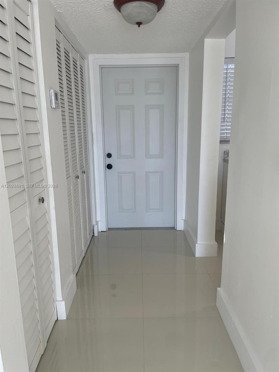 14170 Southwest 84th Street, Unit 402F Miami, FL 33183 - Photo 17 of 36 Hallway to the Bedrooms and Bathrooms.