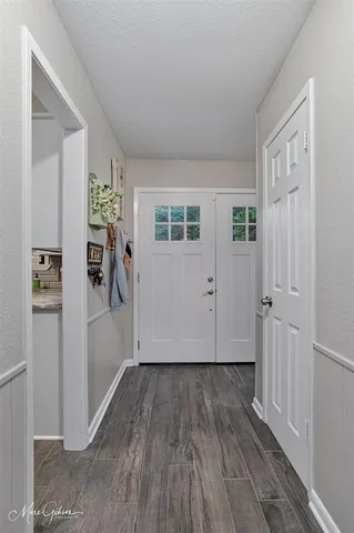 a bathroom with a granite countertop sink a toilet and a mirror