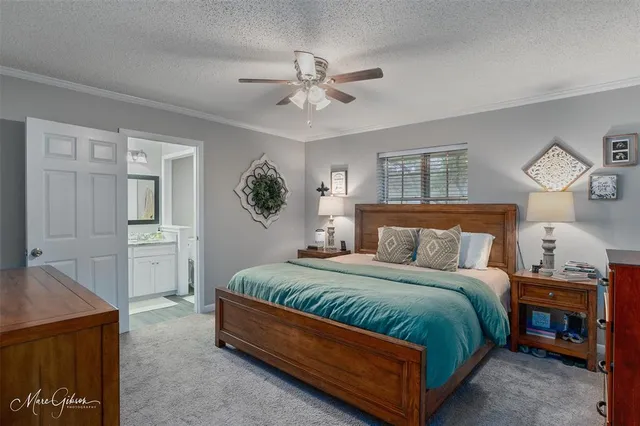 a bathroom with a granite countertop sink toilet and a mirror