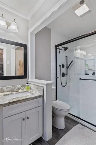 a bathroom with a sink vanity and a mirror
