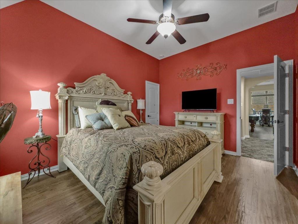 2832 Mona Vale Road Trophy Club, TX 76262 - Photo 29 of 37 a spacious bedroom with a bed and a flat screen tv