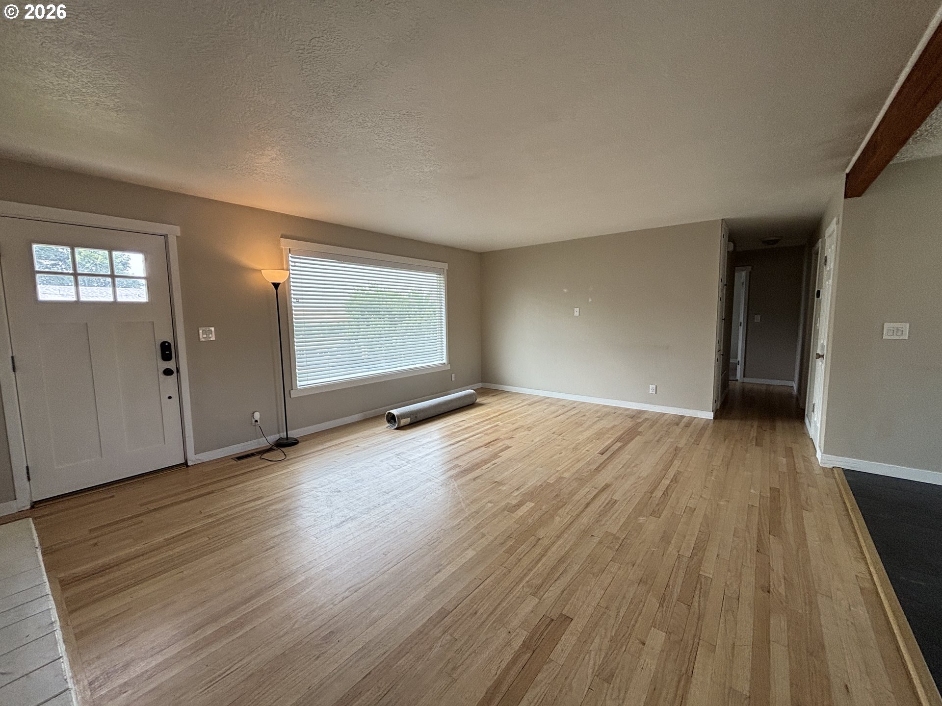 924 Southwest 33rd Street Pendleton, OR 97801 - Photo 3 of 27 wooden floor in an empty room with a window
