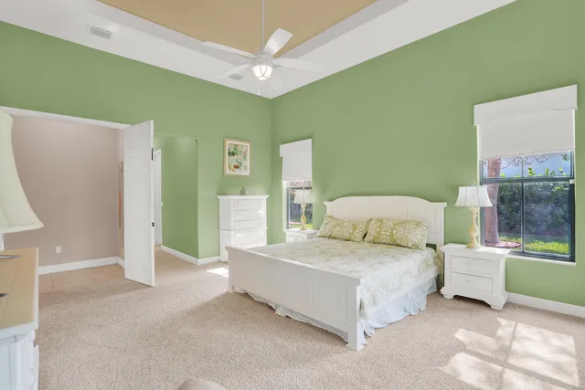 a bedroom with a bed and a table