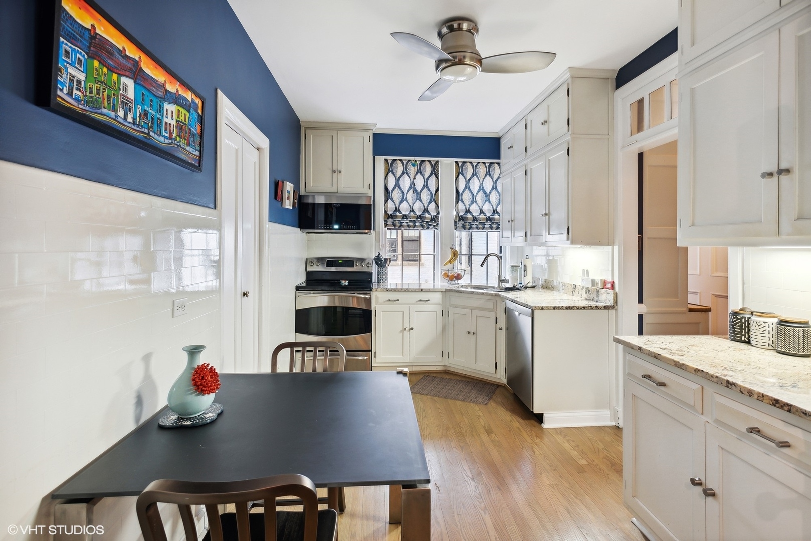 200 Lee Street, Unit 1B Evanston, IL 60202 - Photo 9 of 26 a kitchen with a sink cabinets and wooden floor